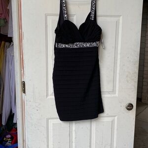 Black dress with silver shiny straps and waist